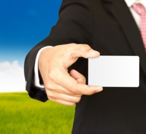 Man holding blank business card
